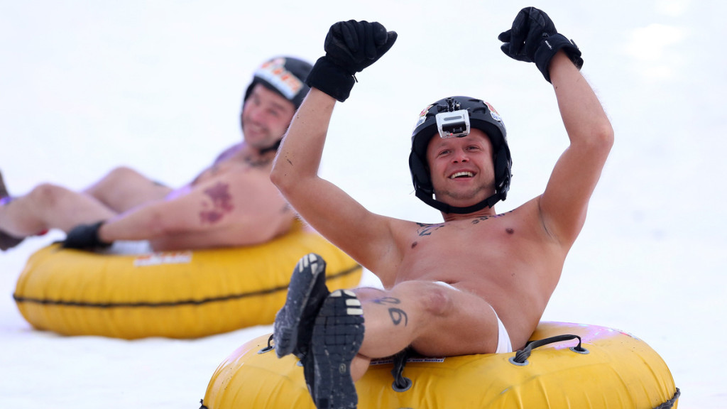 HECKLINGEN, GERMANY - FEBRUARY 15: Male participants compete in the 2014 Naken Sledding World Championships on February 15, 2014 in Hecklingen, near Magdeburg, Germany. The annual event, sponsored by a local radio station, draws thousands of spectators. (Photo by Adam Berry/Getty Images)
