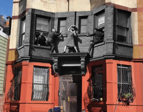 Above 497 Dean Street, Brooklyn. A distraught Edna Egbert battles the police on the ledge of her home.