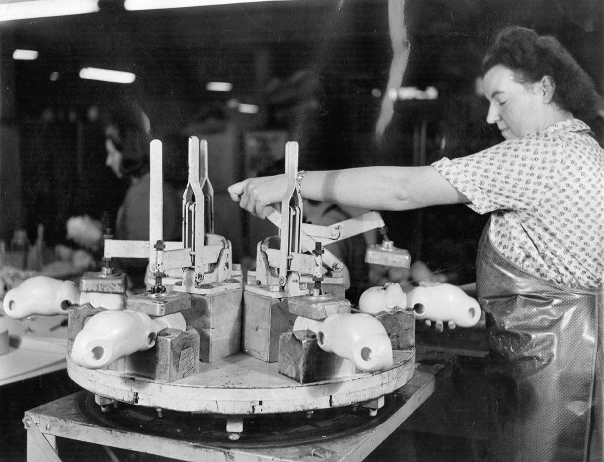 15th December 1951: Portrait of a woman at work in the 'Cascelloid' doll factory in Leicester. Original Publication: Picture Post - 5617 - Toys Are Big Business - pub. 1951 (Photo by Kurt Hutton/Picture Post/Getty Images)