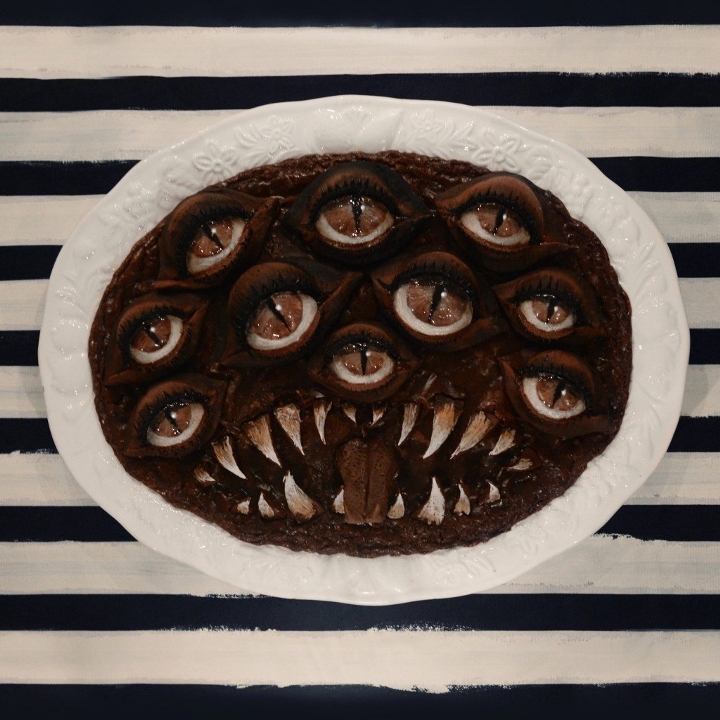 A multi-eyed brownie monster that is equal parts delectable and frightening.